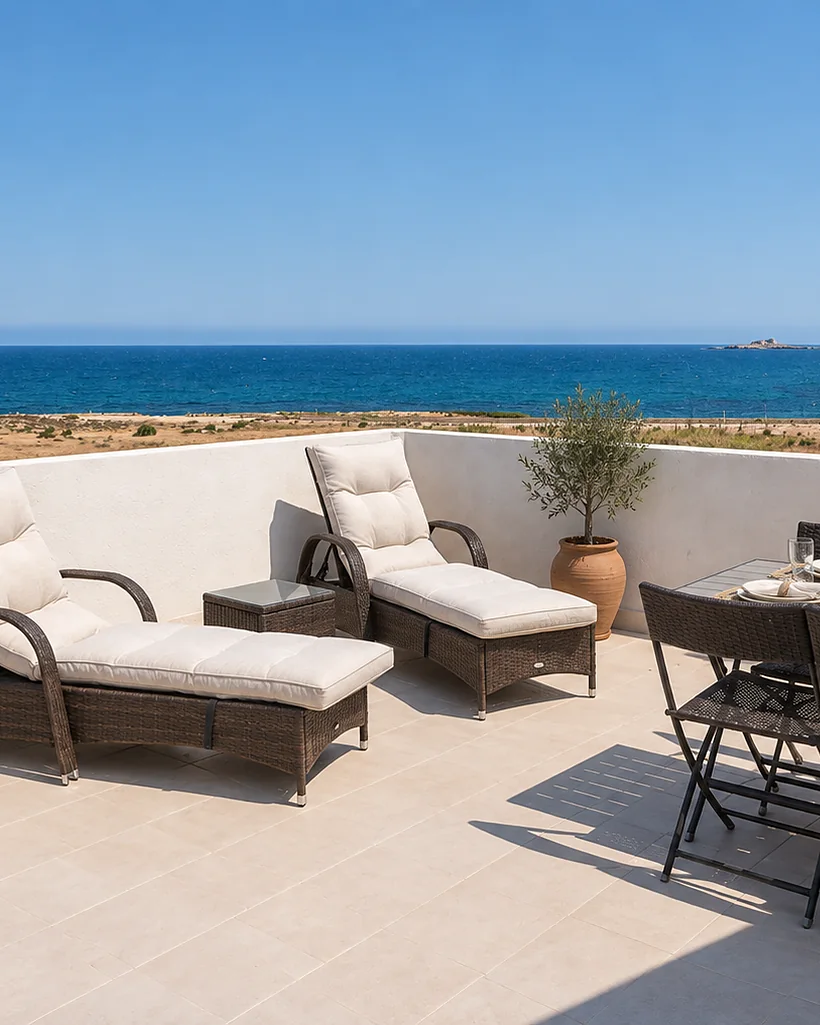 Terrace over the sea with two loungers and an outdoor table: Green Oasi, Sicily
