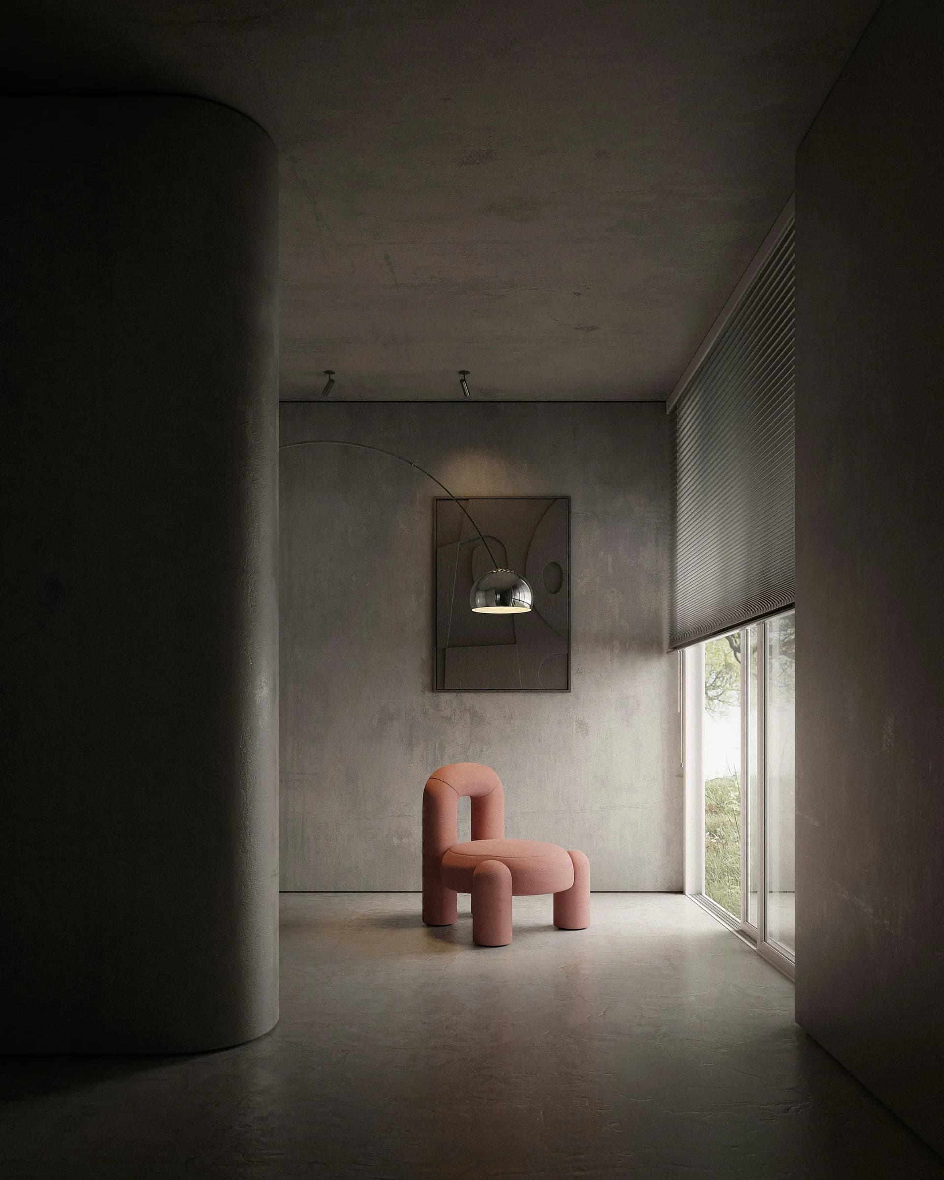 Un ambiente di cemento chiaro con una poltrona dalle forme tonde in fondo e un quadro alla parete